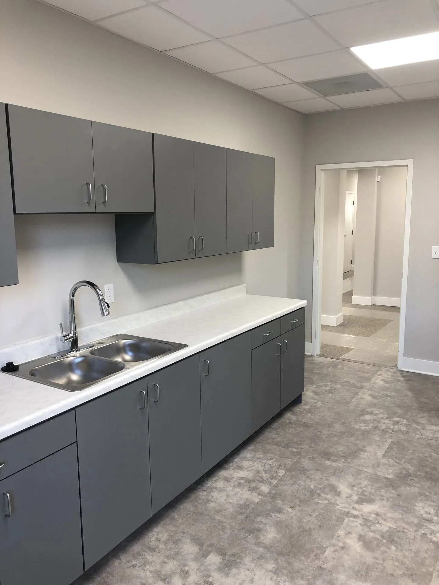Breakroom with modern cabinetry and stainless sink