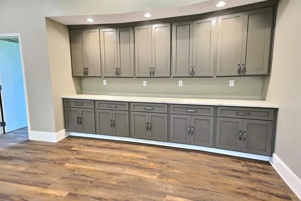 Catering kitchen with white shaker cabinets and view of grounds