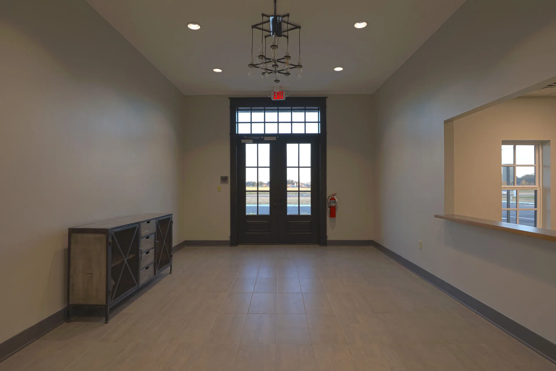 Front door detail — red double-door entry